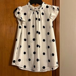White with black polka dot office apparel. Wonderful slimming fit!
